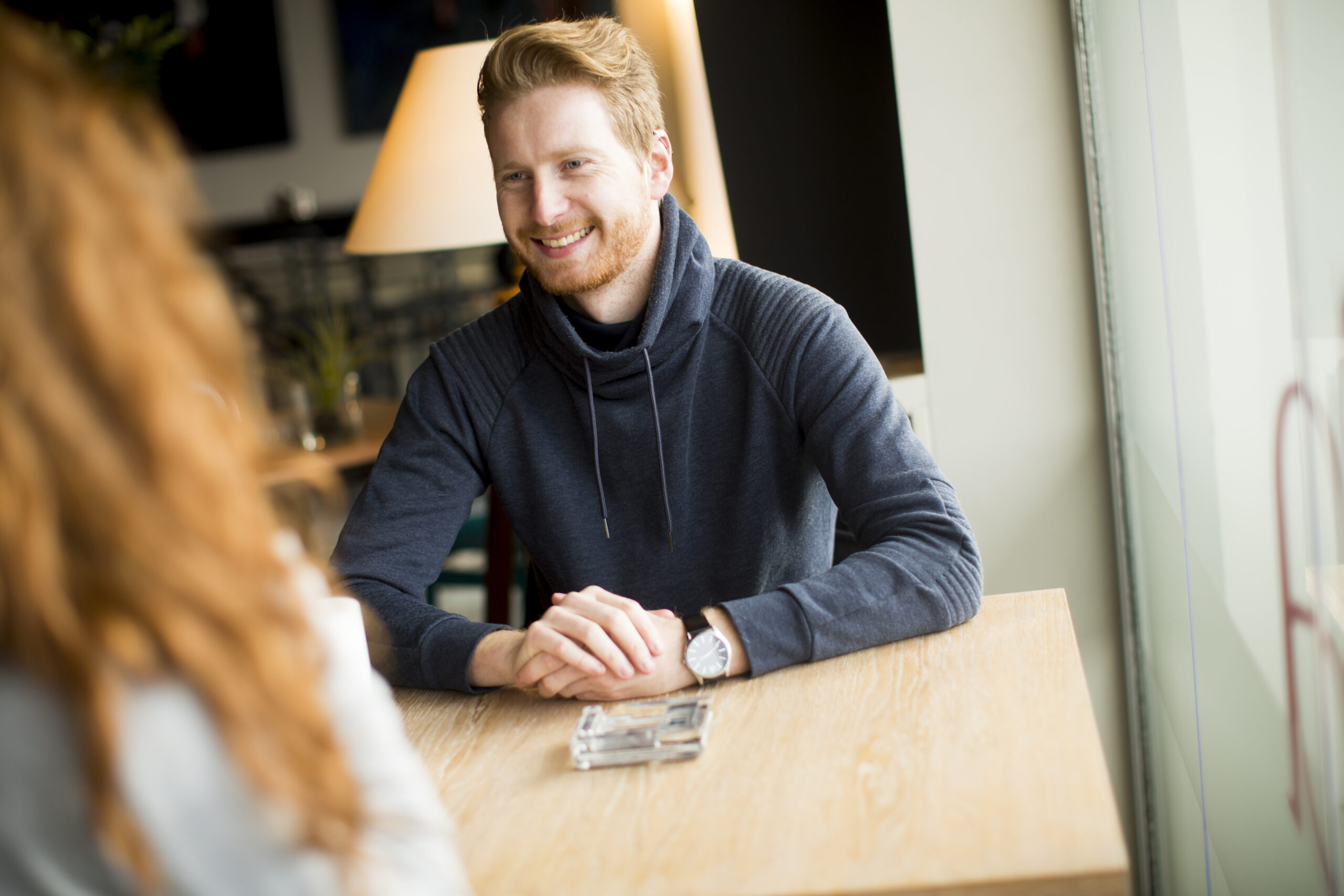 young couple having lunch restaurant scaled